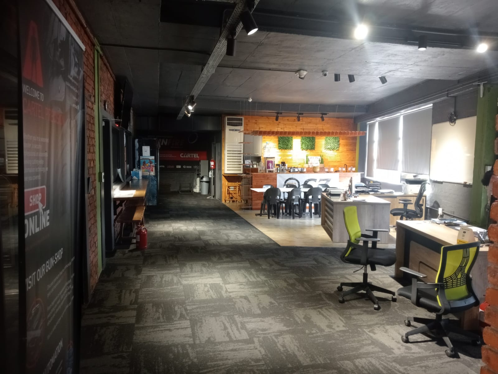 Lounge seating, coffee station and office desks at CARTEL